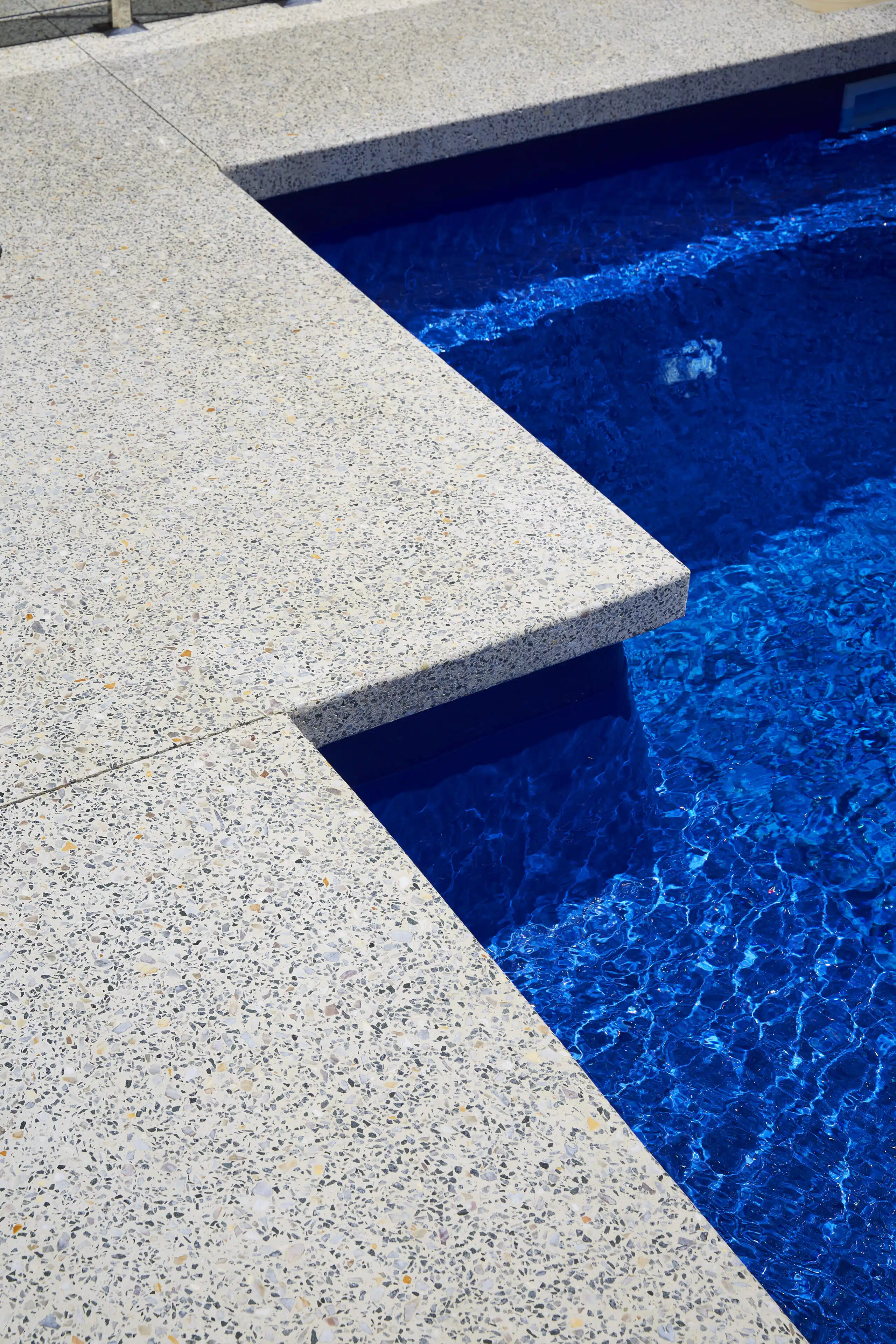 a decorative concrete pool edge