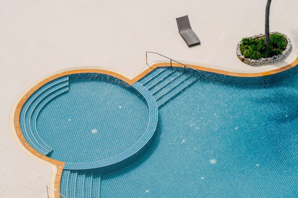 Top down view of a pool surrounded by tiles